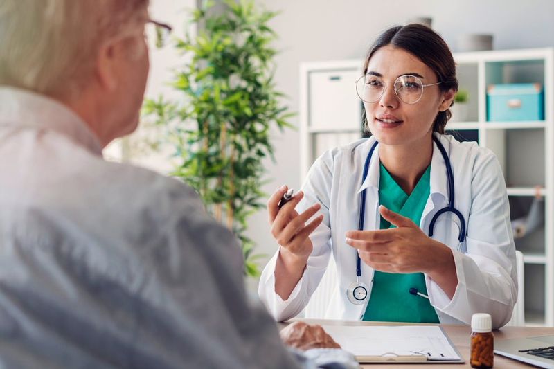 Doctor consulting with patient